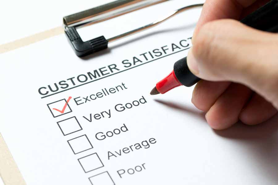 hand checking boxes in a customer survey